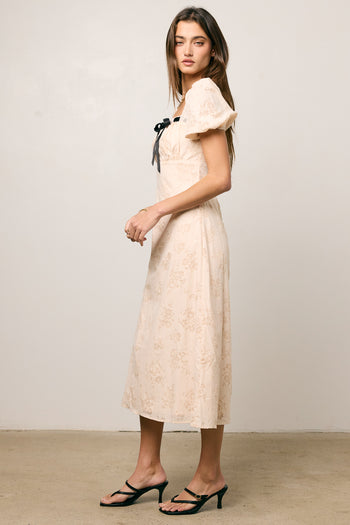 PRINTED CREAM MIDI DRESS WITH BLACK BOW TIE