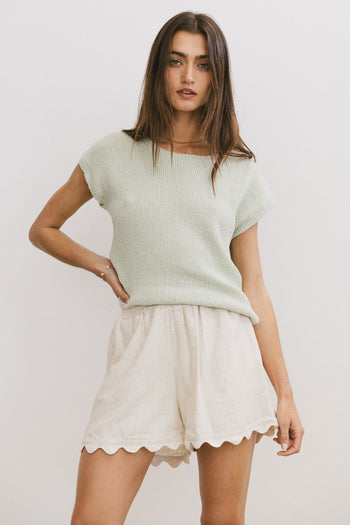 green knit top