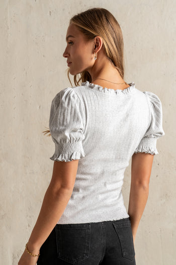 RUFFLE HEMLINE TOP