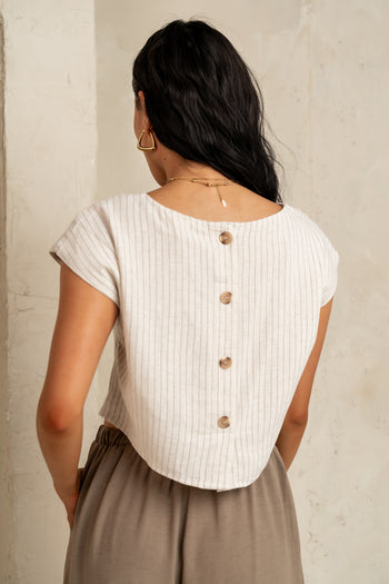 four buttons down the back of shirt