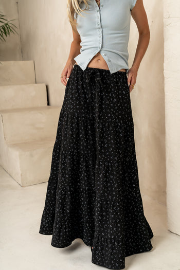 LIGHT BLUE SMALL SETAILS ON BLACK SKIRT 