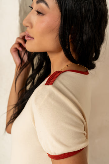 red details on cream tee 