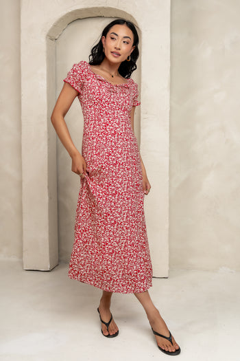 scalloped trim on chest with a small bow