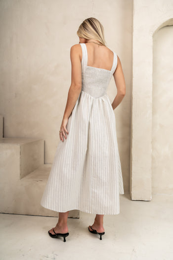 SMOCKED BACK WITH A FLOWY BOTTOM 