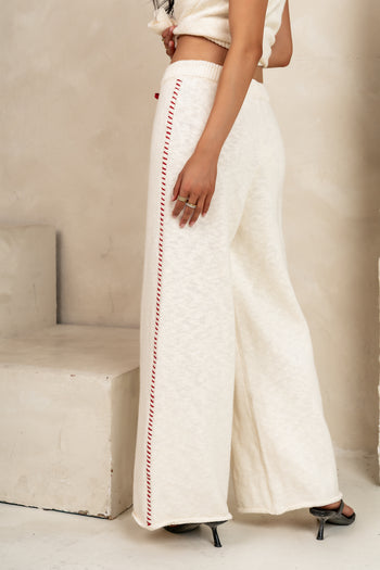 red detail down side of leg 