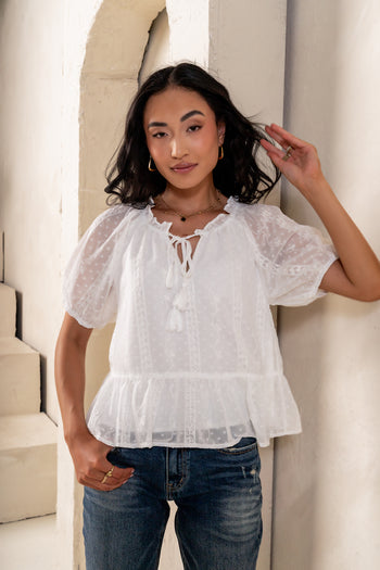 see through top with an ivory liner 