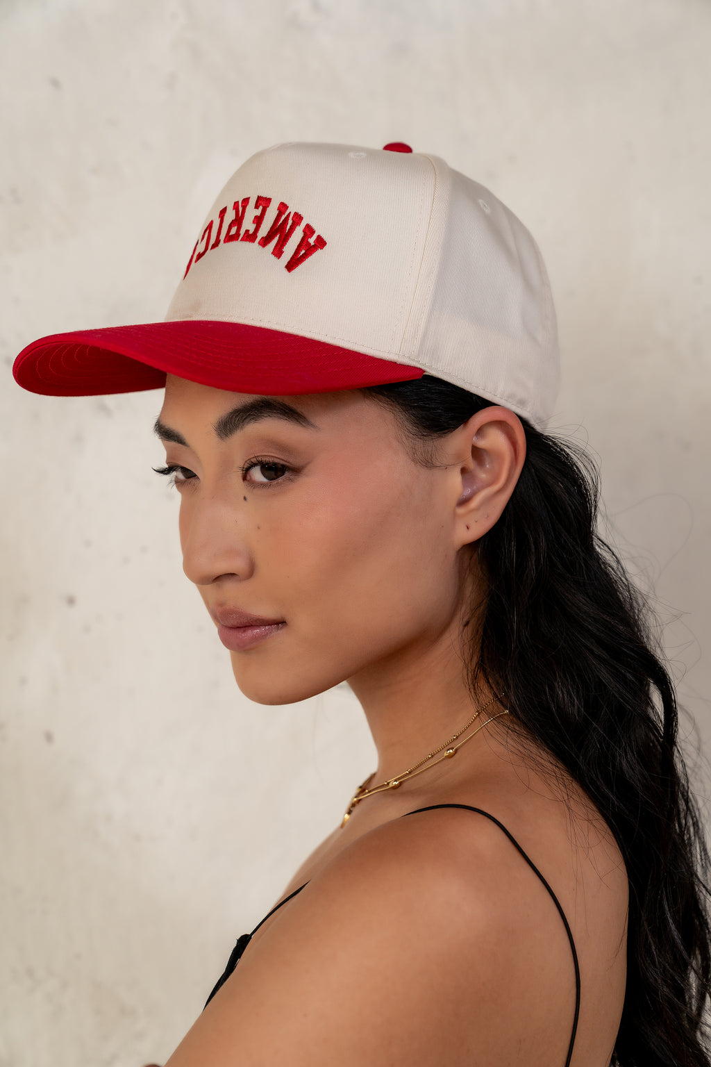 red and cream baseball cap 