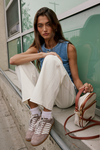 brown thread and seams on white denim pants