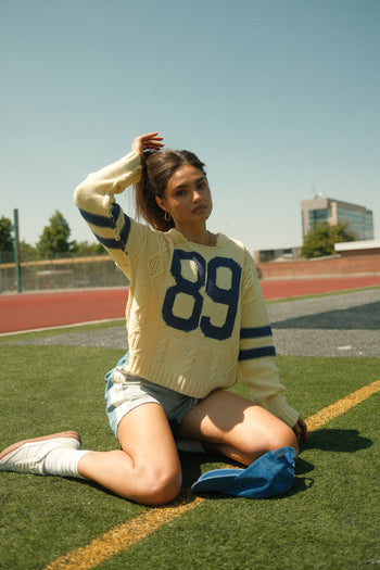  89 graphic yellow sweater 