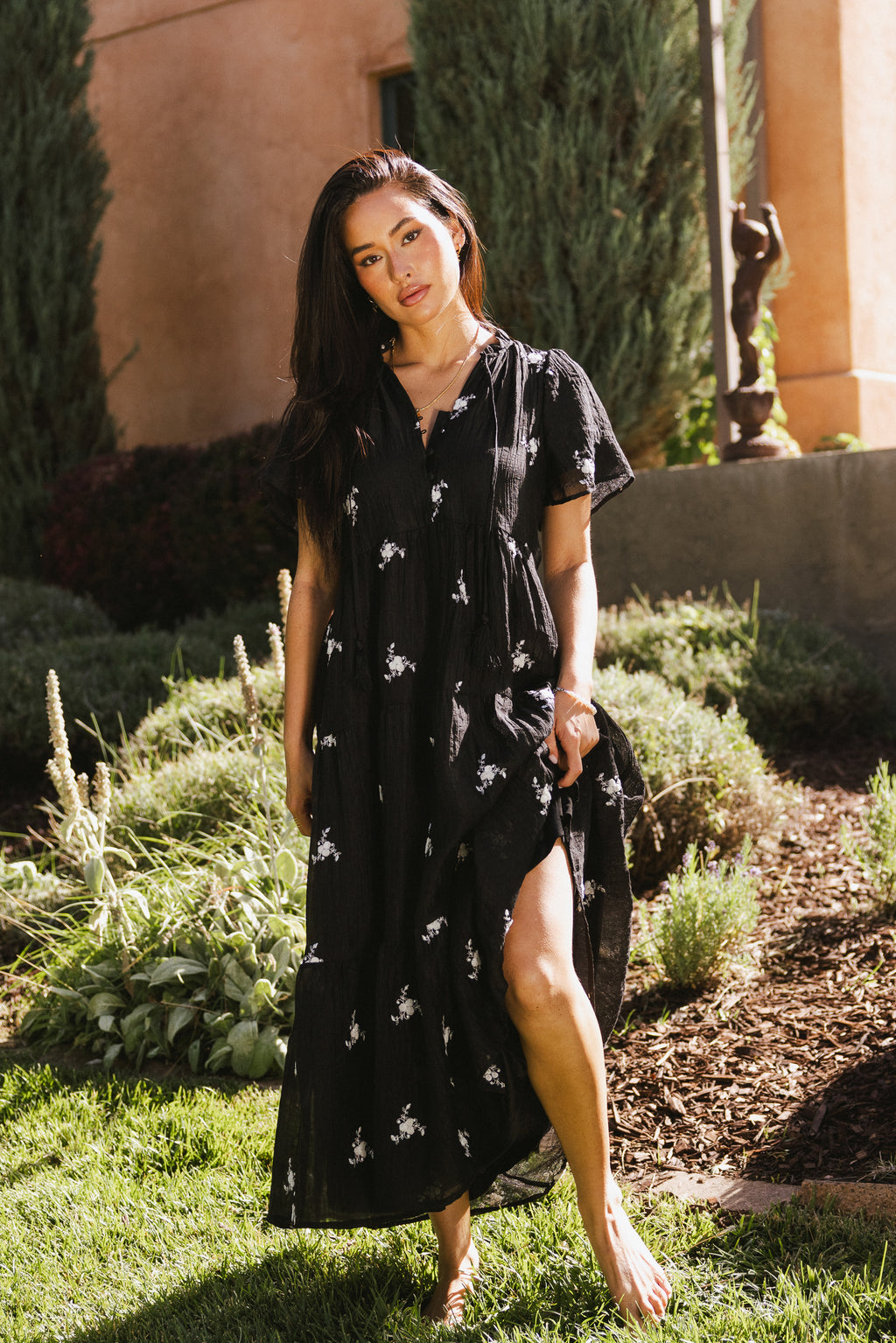 black dress with white floral embroidered details