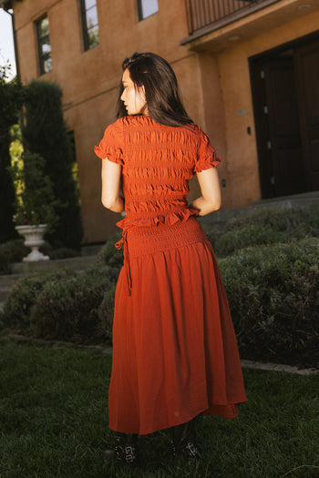 rust colored top