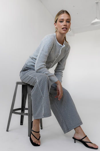 checkered bottoms with grey cardigan