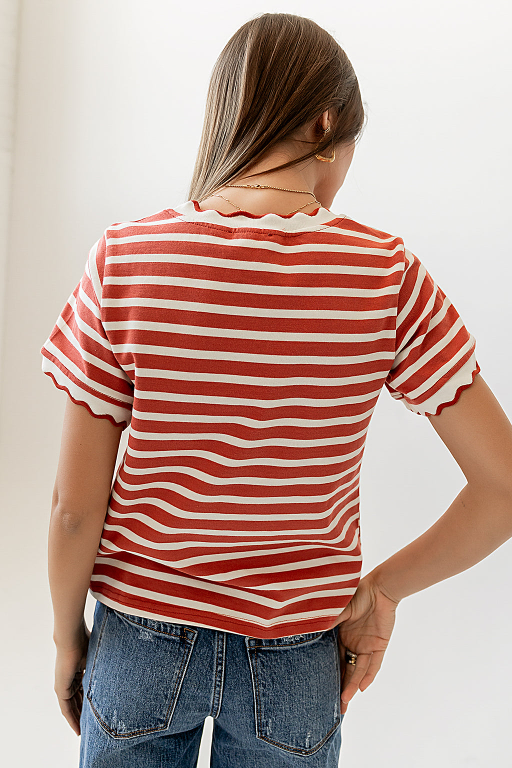 red striped top with scalloped detail