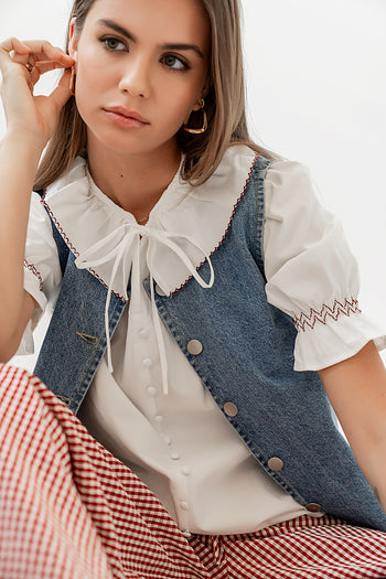 FAKE BUTTONS UP THE FRONT OF SHIRT 