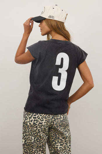 back of shirt with the number three graphic