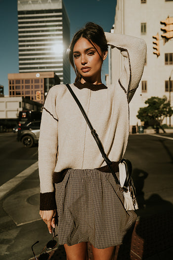 natural sweater with brown hems 