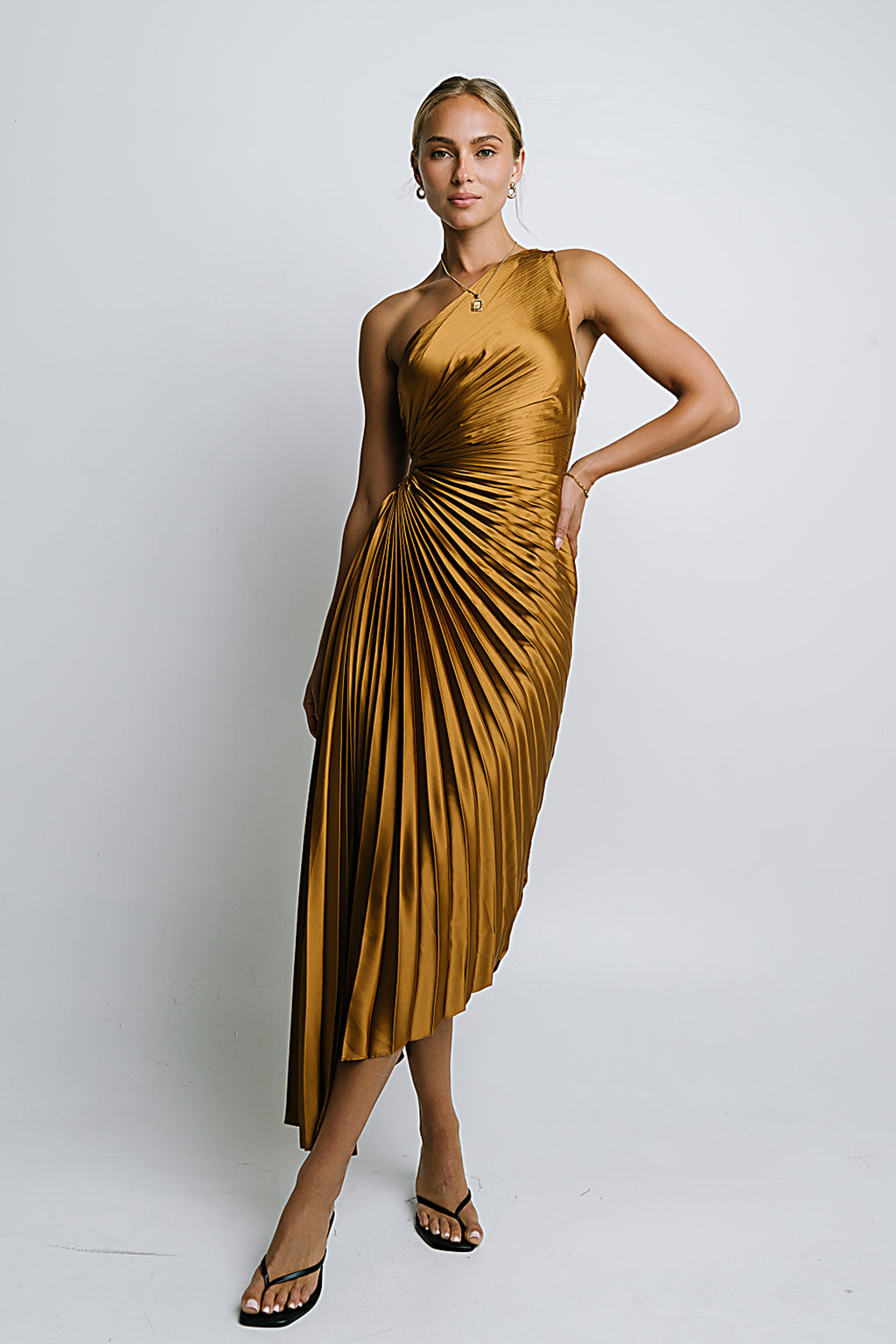 Asymmetrical Pleated Maxi Dress in Gold Asymmetrical Pleated Maxi Dress in Gold