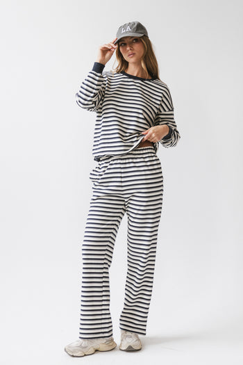 navy pants with white stripes