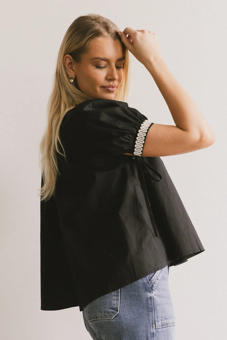 Short embroidered hem sleeves in black 