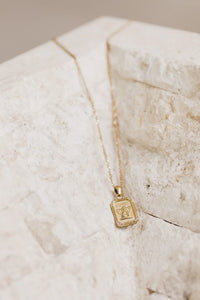 Cupid charm styled necklace in gold 