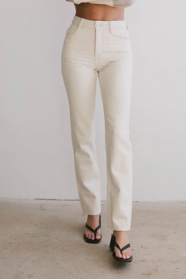 High rise denim pants in cream 