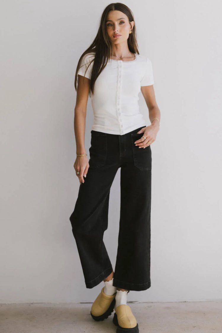 Button up top in white paired with a black denim 
