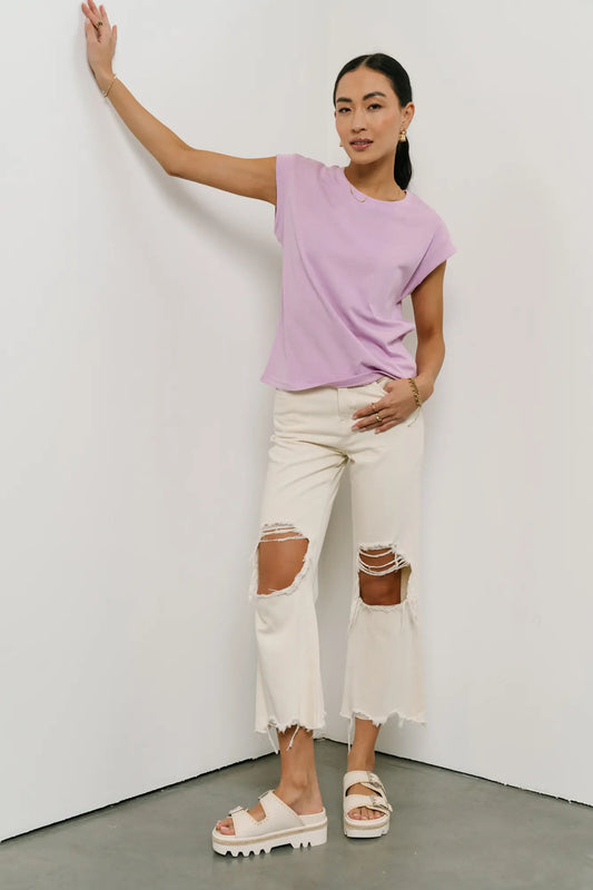 Top in lavender paired with a distressed denim in cream 