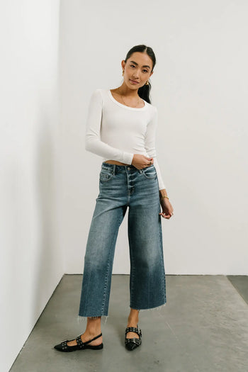 Top in white paired with a denim 