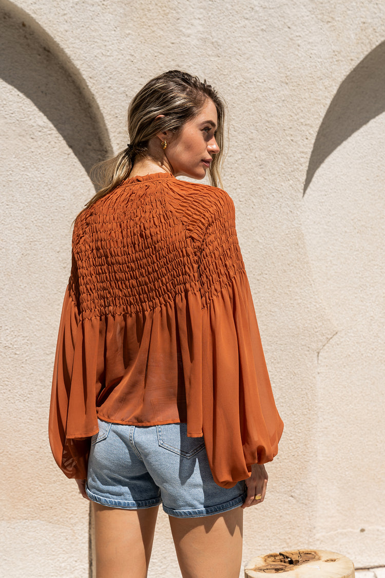 rust long sleeve blouse with puff sleeves