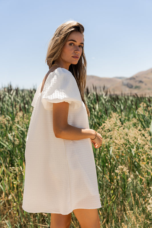 Short puff sleeve white mini dress with slight texture