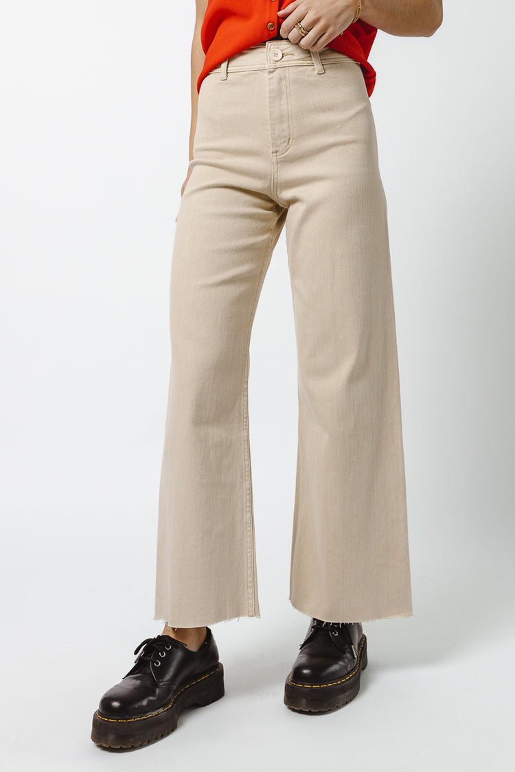 beige wide leg pants paired with black shoes