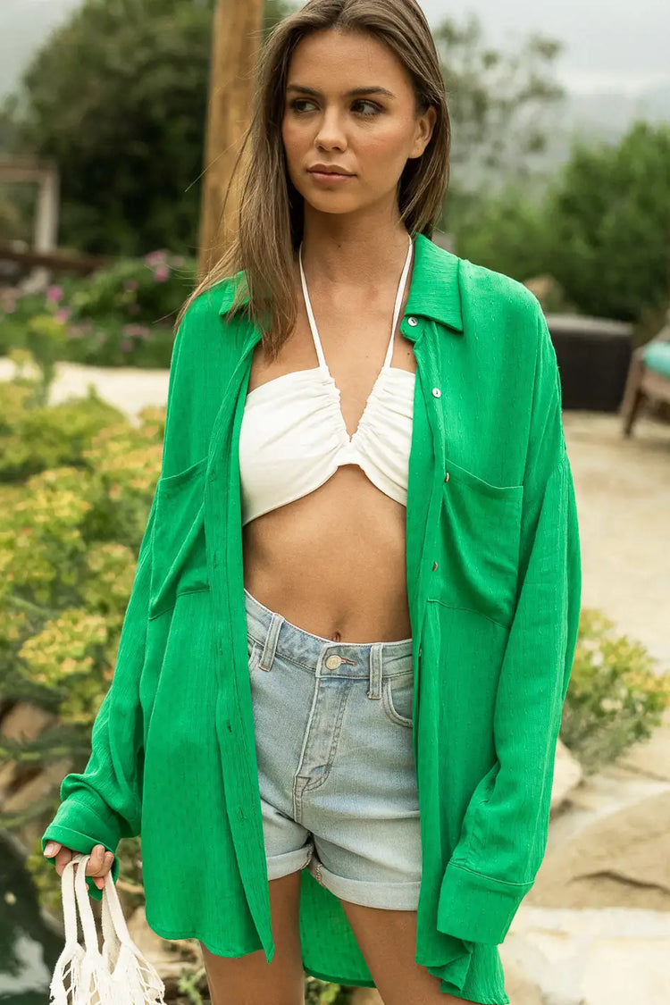 green button up layered with white tank