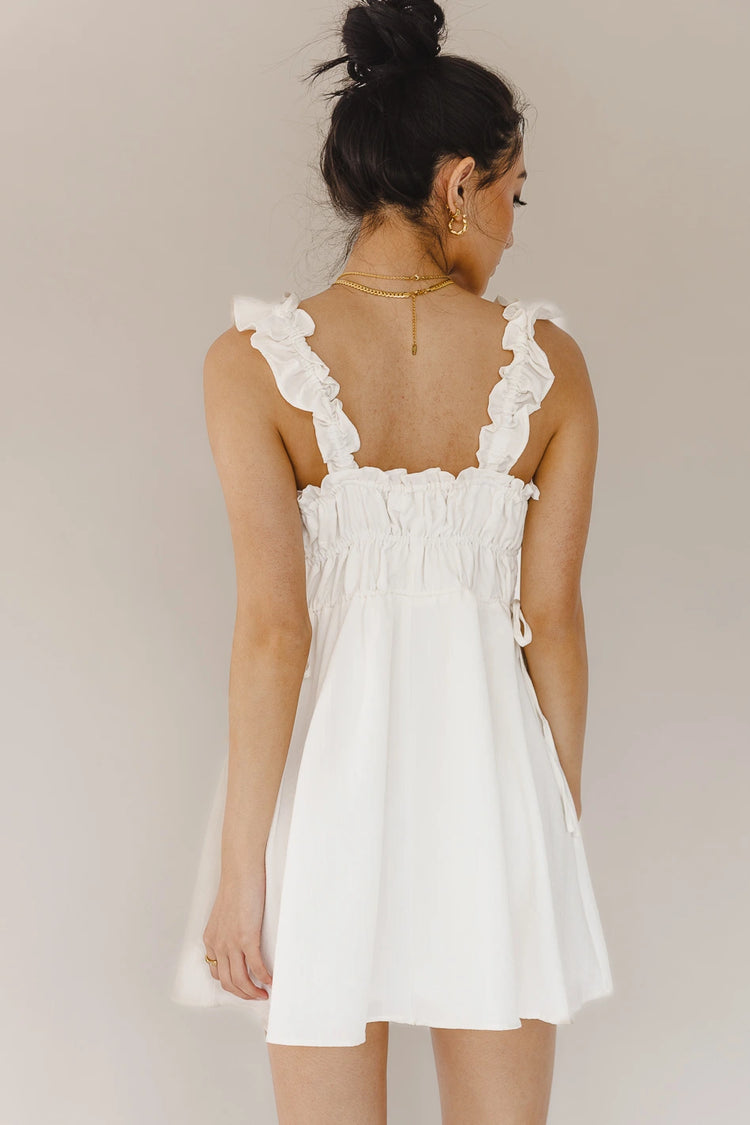 white mini dress with waist cinch detail