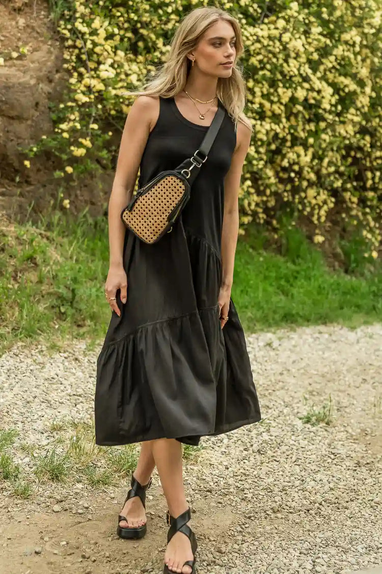 black midi dress paired with black crossbody bag