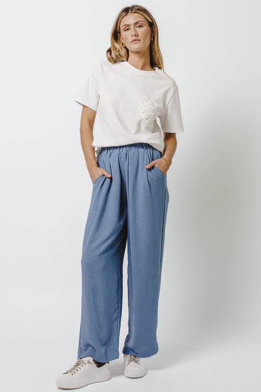 blue wide leg pants with pockets and belt loops 