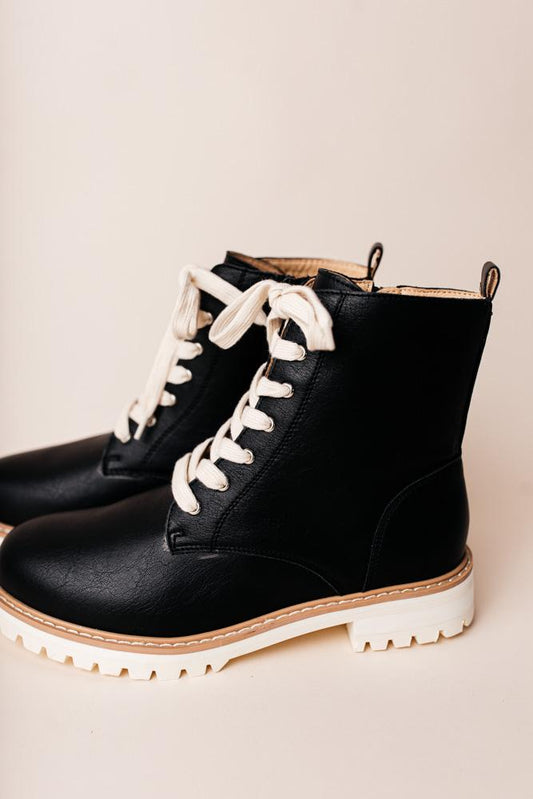 black combat boots with white laces