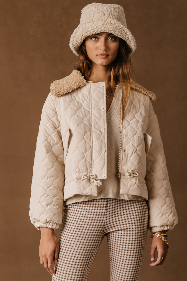 cream quilted jacket with pockets