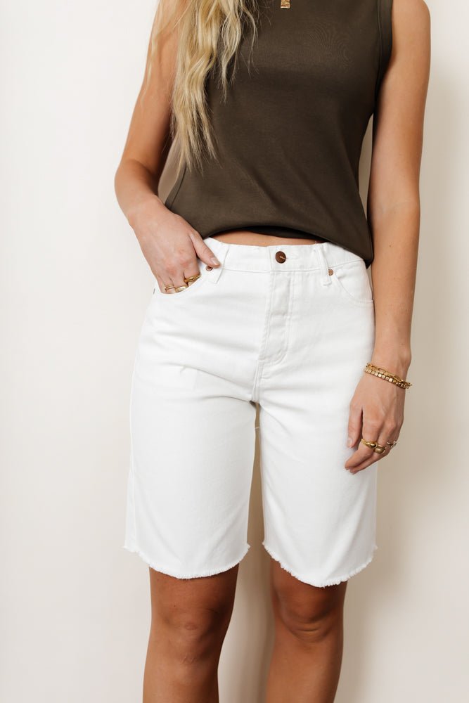 White bermuda short paired with a tank top 