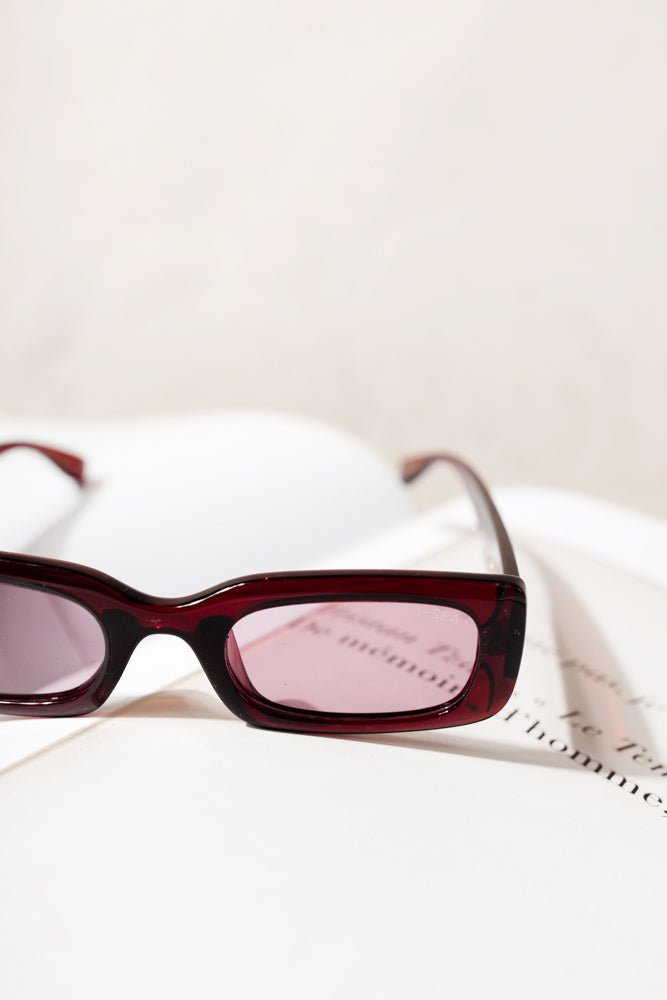 red sunglasses with red tinted lens