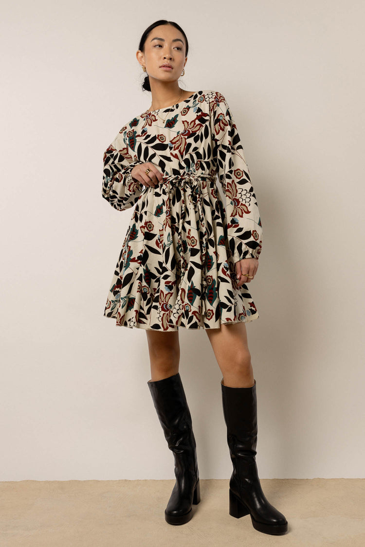 long sleeve floral mini dress with black boots