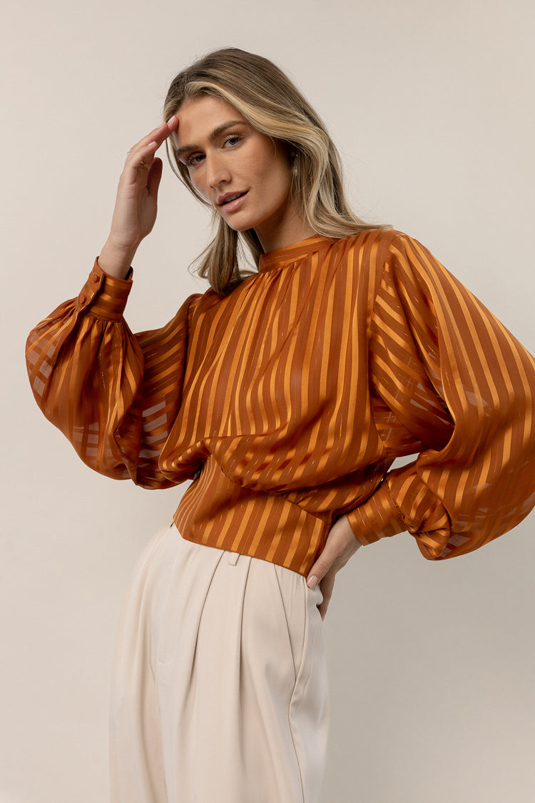 cropped orange blouse with stripes