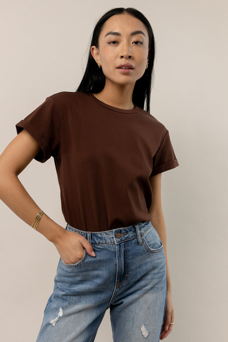 brown tee with rolled sleeves