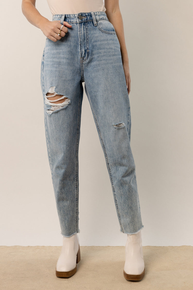 medium wash mom jeans with distressing