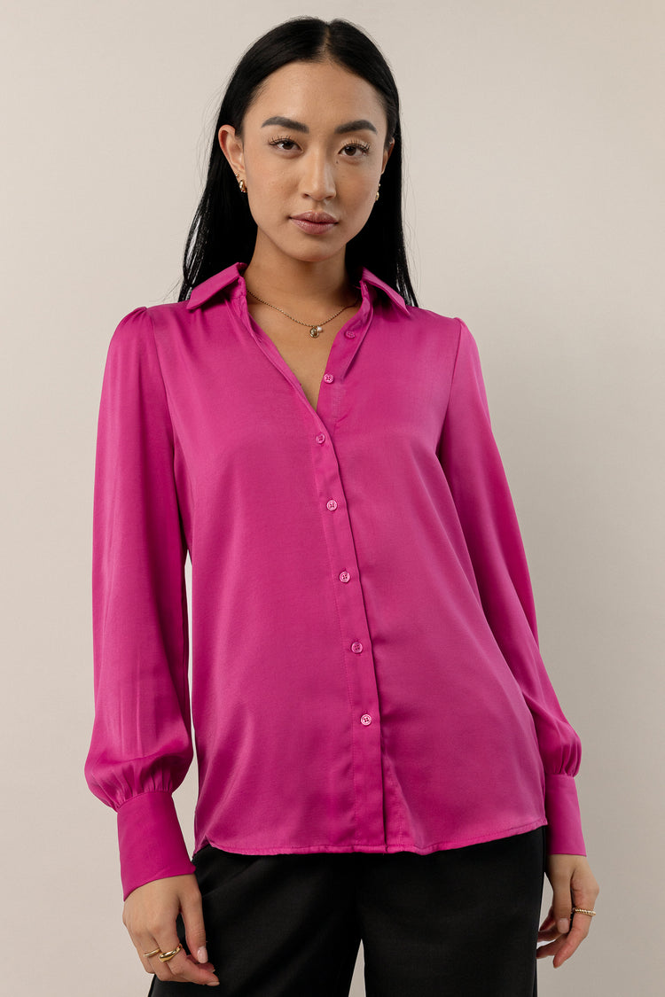 magenta button up with long cuffed sleeves