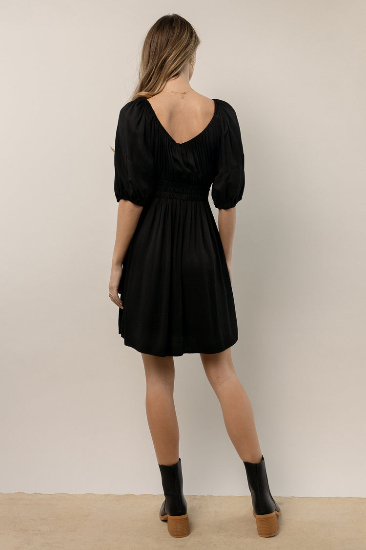 black dress with puff sleeves
