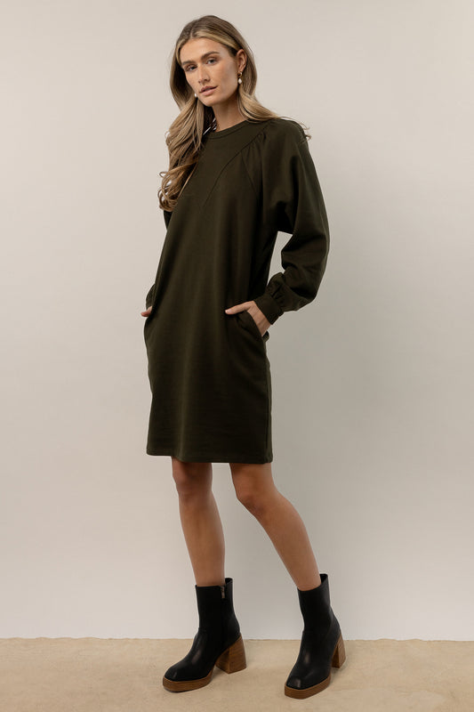 model wearing green long sleeve mini dress