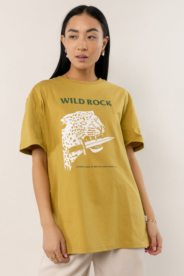 yellow t-shirt with green text and white graphic