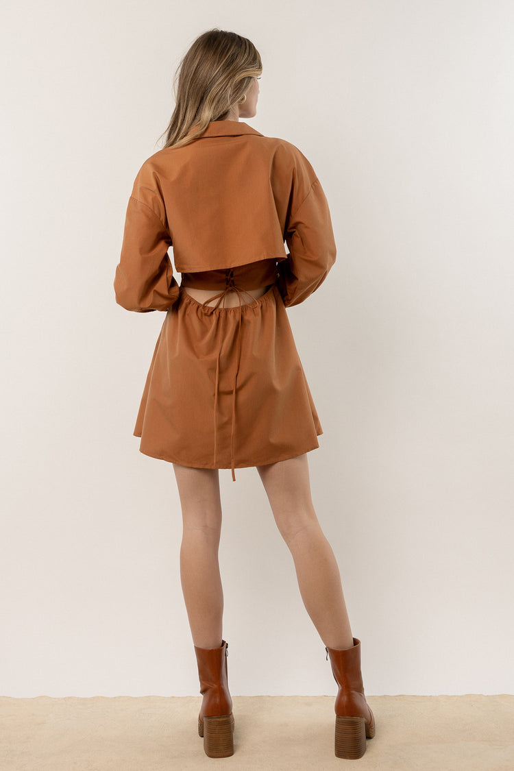 back view of mini dress with brown boots