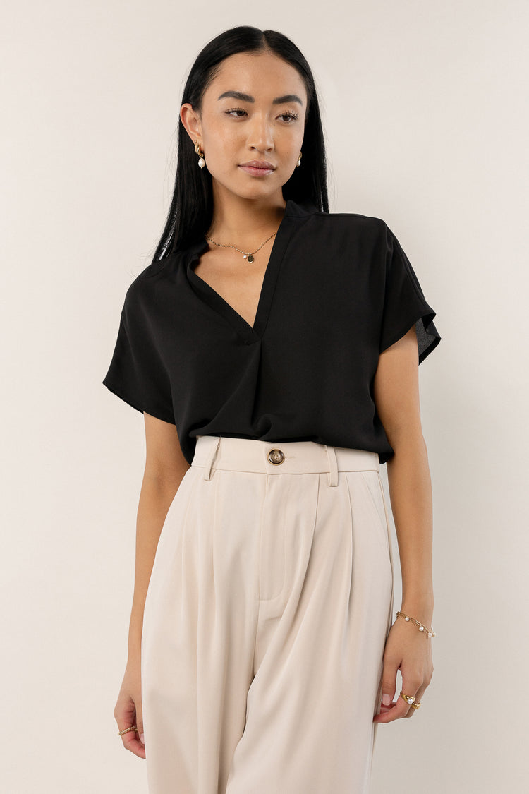 flowy black blouse with V-neck