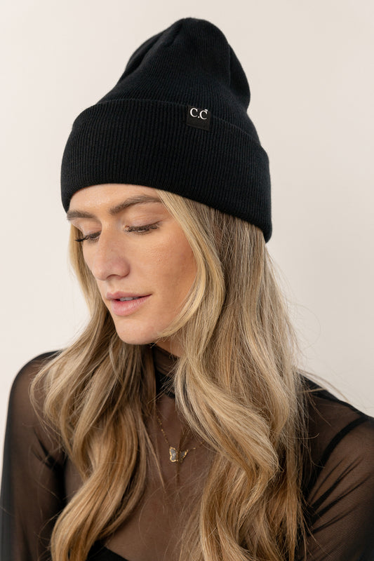 black knit cap with small logo detail